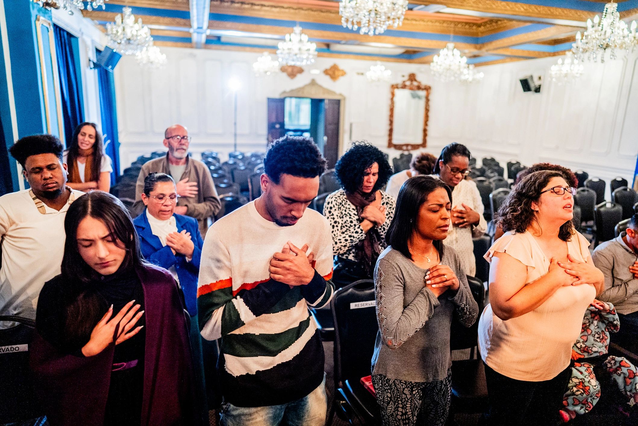 Church community gathered in prayer