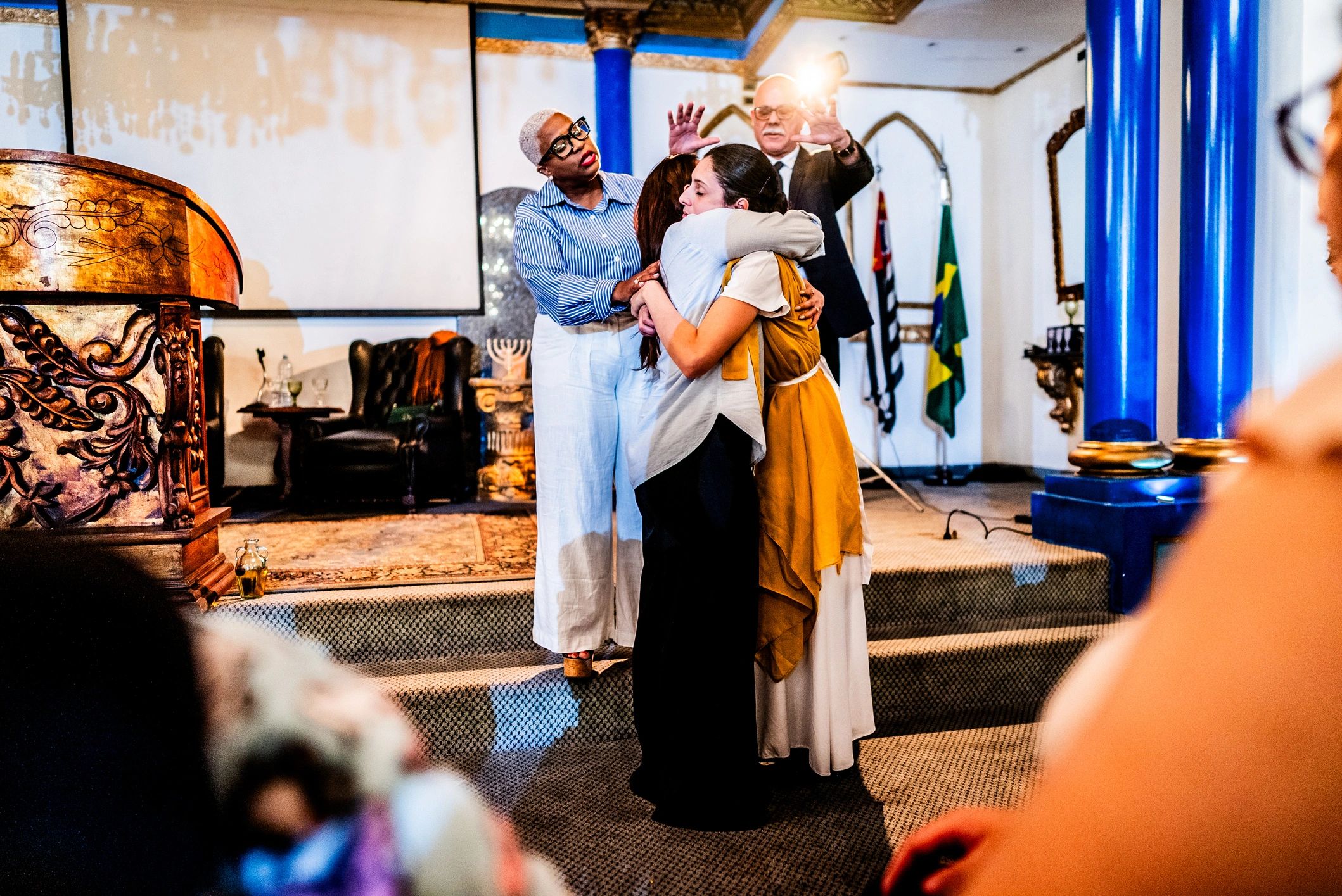 Church members warmly welcoming one another during worship